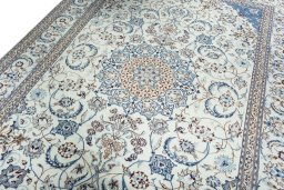 Backside of handmade New Nain rug showing knot structure and weave density