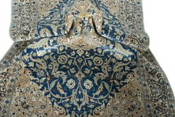Surface texture of 1950s Nain rug with natural Cork and intricate pattern