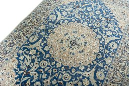 Backside of handmade 1950s Nain rug showing knot structure and weave density