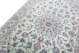 Backside of handmade New Nain rug showing knot structure and weave density