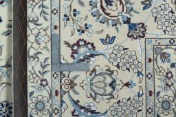 Backside of handmade 2000s Nain rug showing knot structure and weave density