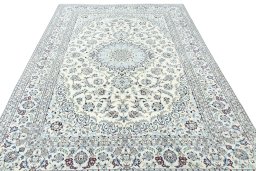 Surface texture of 2000s Nain rug with natural Wool and intricate pattern