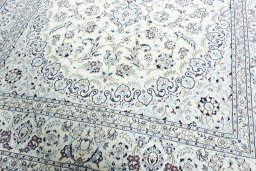 Close-up detail of 2000s Nain rug from Iran / Persia showing Wool weave