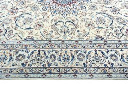 Corner detail of New Nain rug showing border pattern and Wool pile
