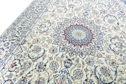 Backside of handmade New Nain rug showing knot structure and weave density