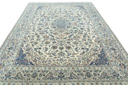 Surface texture of 2000s Nain rug with natural Wool and intricate pattern