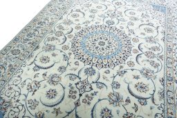 Backside of handmade New Nain rug showing knot structure and weave density