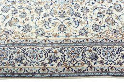 Corner detail of 2000s Nain rug showing border pattern and Wool pile