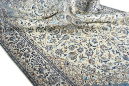 Surface texture of 2000s Nain rug with natural Wool and intricate pattern