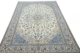 Surface texture of 2000s Nain rug with natural Wool and intricate pattern