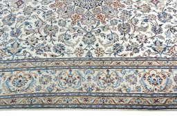 Corner detail of 2000s Nain rug showing border pattern and Wool pile