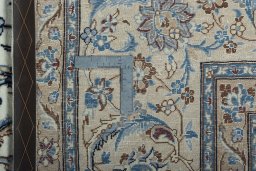 Backside of handmade 2000s Nain rug showing knot structure and weave density