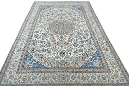 Surface texture of 2000s Nain rug with natural Wool and intricate pattern