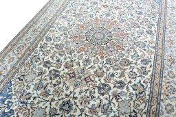 Backside of handmade 2000s Nain rug showing knot structure and weave density