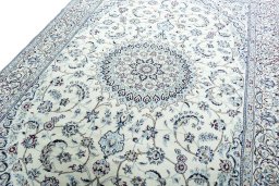 Backside of handmade New Nain rug showing knot structure and weave density