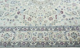 Corner detail of New Nain rug showing border pattern and Wool pile