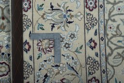 Backside of handmade New Nain rug showing knot structure and weave density