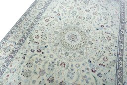 Backside of handmade New Nain rug showing knot structure and weave density
