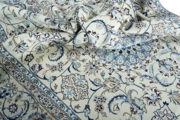 Surface texture of New Nain rug with natural Wool and intricate pattern
