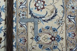 Backside of handmade New Nain rug showing knot structure and weave density