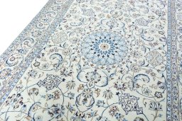Backside of handmade New Nain rug showing knot structure and weave density