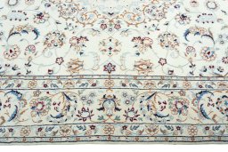 Corner detail of 2000s Nain rug showing border pattern and Wool pile