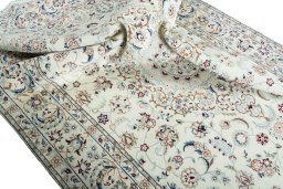 Surface texture of 2000s Nain rug with natural Wool and intricate pattern