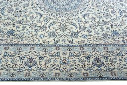 Corner detail of 2000s Nain rug showing border pattern and Wool pile