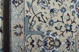 Backside of handmade 2000s Nain rug showing knot structure and weave density