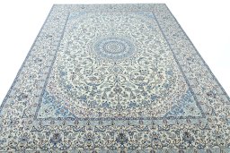 Surface texture of 2000s Nain rug with natural Wool and intricate pattern