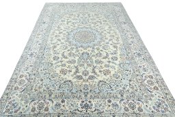 Surface texture of 2000s Nain rug with natural Wool and intricate pattern