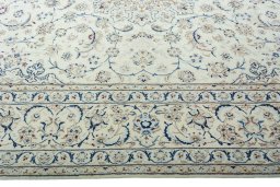 Corner detail of 2000s Nain rug showing border pattern and Wool pile