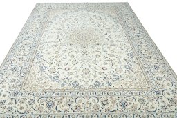 Surface texture of 2000s Nain rug with natural Wool and intricate pattern