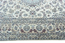 Corner detail of 2000s Nain rug showing border pattern and Wool pile