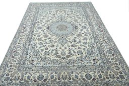 Surface texture of 2000s Nain rug with natural Wool and intricate pattern