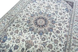 Backside of handmade New Nain rug showing knot structure and weave density