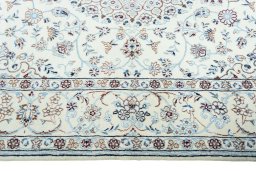 Corner detail of 2000s Nain rug showing border pattern and Wool pile