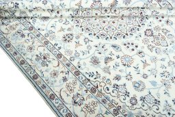Close-up detail of 2000s Nain rug from Iran / Persia showing Wool weave