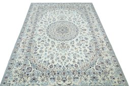 Surface texture of 2000s Nain rug with natural Wool and intricate pattern