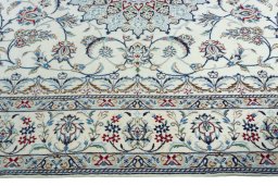 Corner detail of 2000s Nain rug showing border pattern and Wool pile