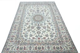 Surface texture of 2000s Nain rug with natural Wool and intricate pattern