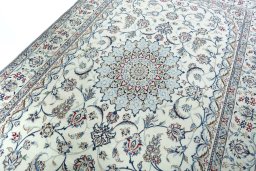 Backside of handmade 2000s Nain rug showing knot structure and weave density