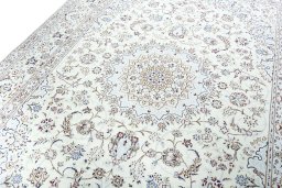Backside of handmade New Nain rug showing knot structure and weave density