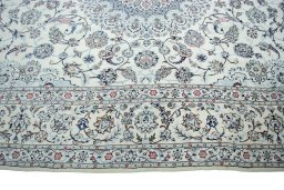 Corner detail of New Nain rug showing border pattern and Wool pile