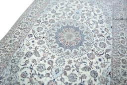 Backside of handmade New Nain rug showing knot structure and weave density