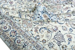 Backside of handmade New Nain rug showing knot structure and weave density