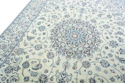 Backside of handmade New Nain rug showing knot structure and weave density