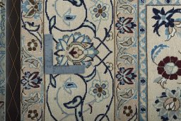Backside of handmade New Nain rug showing knot structure and weave density