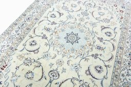 Backside of handmade New Nain rug showing knot structure and weave density