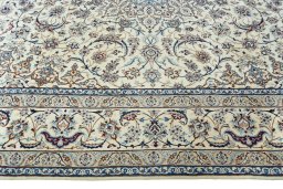 Corner detail of New Nain rug showing border pattern and Wool pile